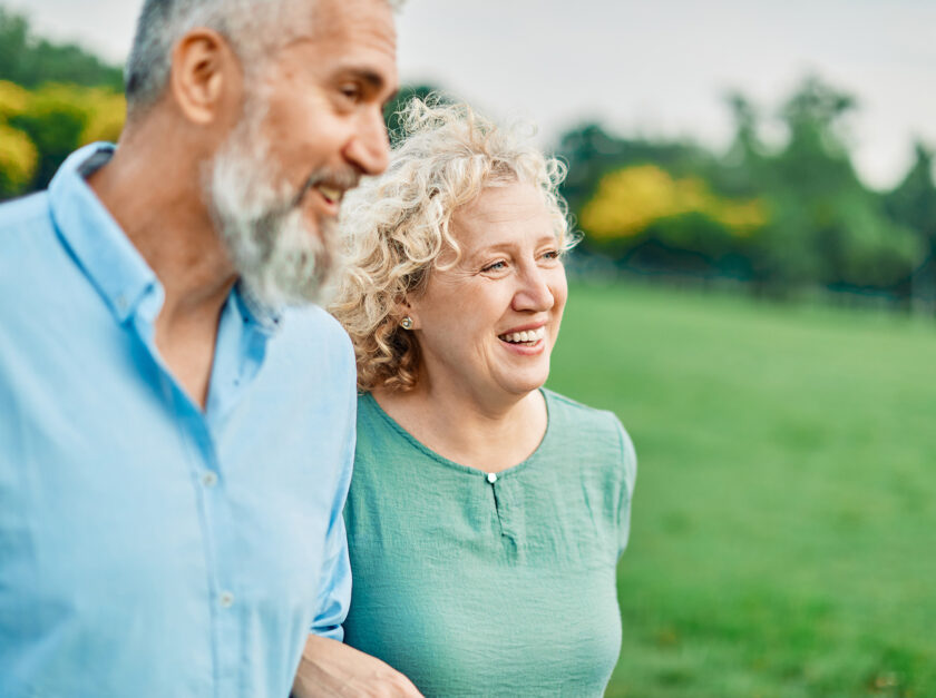 Happy middle-aged couple smiling.
